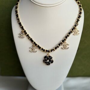 Chic Black and Gold Necklace with Iconic Charms